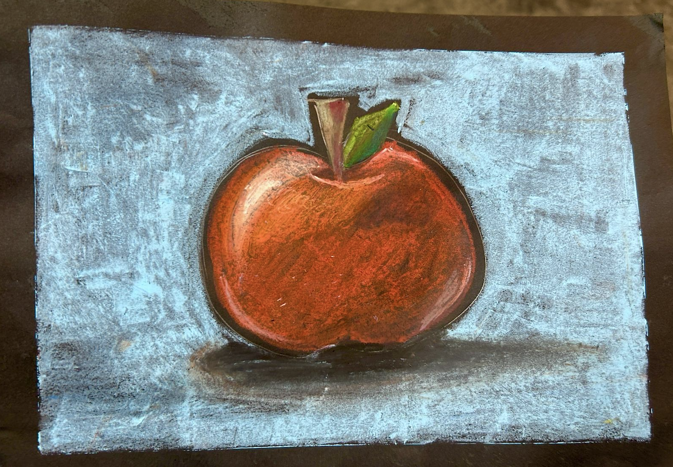 Students learning art in a bright, welcoming studio environment